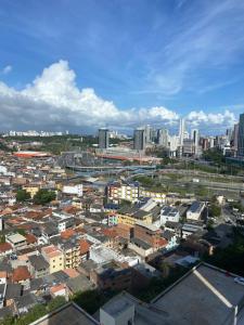 an overhead view of a city with tall buildings at AP Novo Mobiliado in Salvador