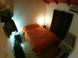 Una cama o camas en una habitación de Aparts La Malena - Solar de Los Molinos (Los Reartes, Cba)