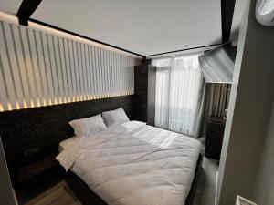 Postel nebo postele na pokoji v ubytování BALA HOTEL
