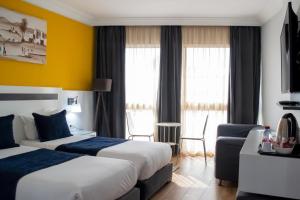 Voodi või voodid majutusasutuse Hotel Le Musée toas