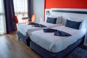 Voodi või voodid majutusasutuse Hotel Le Musée toas