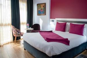 Voodi või voodid majutusasutuse Hotel Le Musée toas