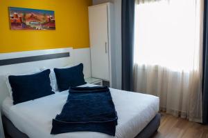 Voodi või voodid majutusasutuse Hotel Le Musée toas