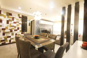 a dining room with a table and chairs at 3 Bedroom in Tuscany Private Estate BGC in Manila