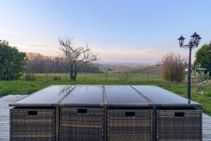 a ping pong table on top of a tennis court at Villa Reims Epernay Champagne Vineyard in Villers-Allerand