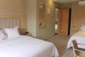 Voodi või voodid majutusasutuse HOTEL CAFE PALAIS SALAM , Beni Mellal toas