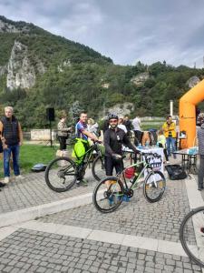 a group of people standing next to their bikes at Apartman Andrić in Višegrad