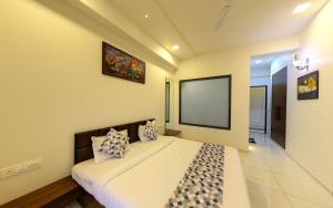 מיטה או מיטות בחדר ב-anantam resort