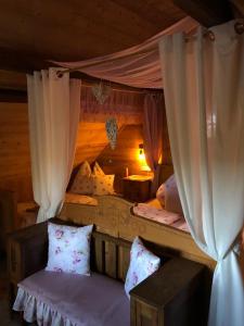 a bedroom with two bunk beds with curtains at Ferienhaus Pliescherhof in Turnau