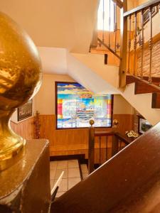 a staircase with a stained glass window in a building at El Tejo de Comillas in Comillas