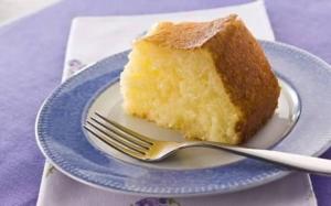 a piece of cake on a plate with a fork at Engenheiros Hotel - Porto Velho in Porto Velho