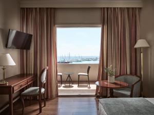 a hotel room with a view of the ocean at Strada Marina Hotel in Zakynthos