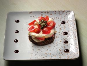 a piece of food on a plate on a table at Strada Marina Hotel in Zakynthos