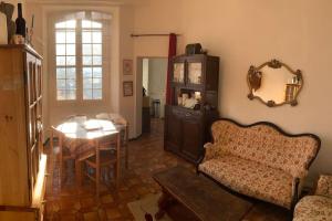 a living room with a couch and a table at Chez Sigmund et Skywalker in Lachau