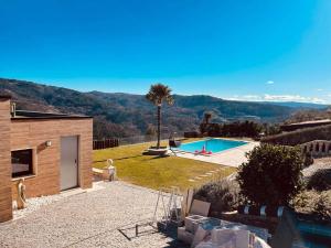 a house with a swimming pool in a yard at Casa Bella Vista in Fafe