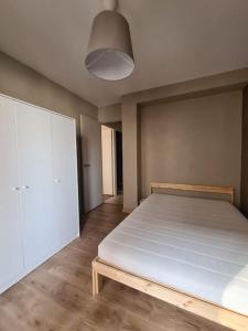 Posteľ alebo postele v izbe v ubytovaní Grand Appart idéal Famille/Remote 5eme