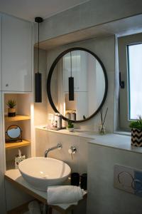 a bathroom with a sink and a mirror at PANORMUS Luxury House in Panormos Rethymno