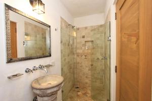 a bathroom with a sink and a shower at El Secreto in San Miguel de Allende