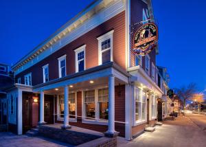 a building with a sign on the side of it at Bouchard Restaurant & Inn in Newport