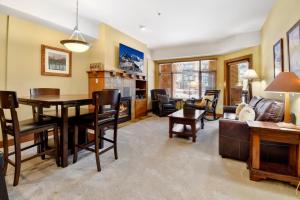 a living room with a table and a couch at Ski in Ski Out at Sundial Lodge Walk out to Pool 2BR C006 in Park City