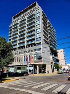 a tall building on the corner of a street at Dptos amoblados NQN - Excelente ubicacion- ZONA CENTRO in Neuquén