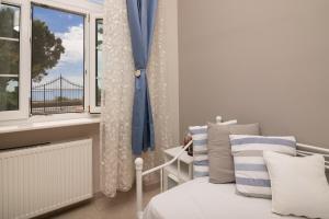 Postel nebo postele na pokoji v ubytování Luna Apartments