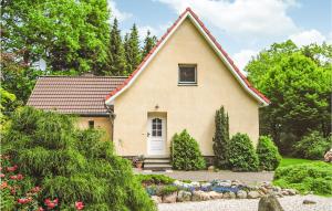 a small yellow house with a red roof at Pet Friendly Home In Brekendorf With Kitchen in Brekendorf