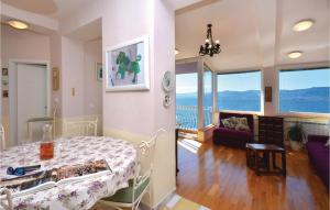 a room with a bed and a table in a room at 3 Bedroom Nice Apartment In Split in Split