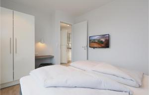 Postel nebo postele na pokoji v ubytování Dünenvilla 8, Whg 1