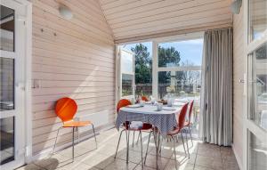 a dining room with a table and chairs at Lovely Home In Hadsund With Wifi in Hadsund