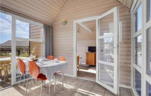 a dining room with a table and chairs at Lovely Home In Hadsund With Wifi in Hadsund