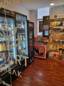 a grocery store with two refrigerators and a grocery store at Alphaville Stadium Residence in Barueri