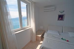 Posteľ alebo postele v izbe v ubytovaní Apartments Tamarix