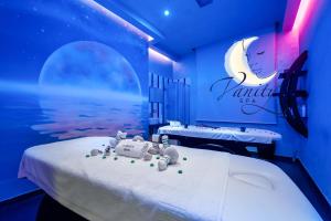 a room with a bed with teddy bears on it at Vanity SPA in Balestrate