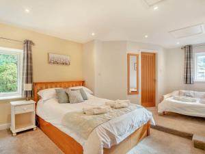 a bedroom with two beds in a room at Kiln Hill Cottage in Pateley Bridge