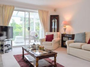 a living room with a couch and a coffee table at Penhayes View in Kenton