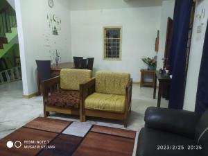 Posezení v ubytování Homestay Budget Bukit Beruntung