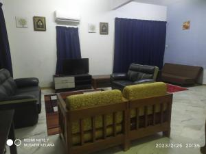 Posezení v ubytování Homestay Budget Bukit Beruntung