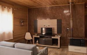 TV a/nebo společenská místnost v ubytování Casa do Guiga