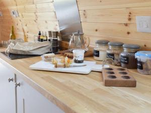 a kitchen counter with food and jars on it at Pentland Pod in Penicuik