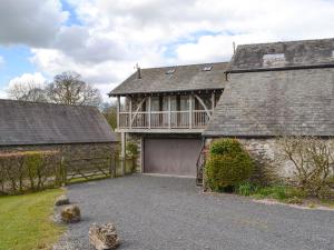 a large house with a garage and a building at Staveley Park Studio - Uk33716 in Staveley