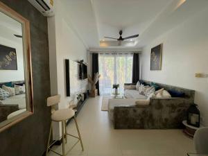 a large living room with a couch and a bed at Villa Sumalee Sea' View in Koh Samui