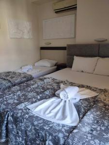 Postel nebo postele na pokoji v ubytování VILLA ARHONTISA + 8 fotografií