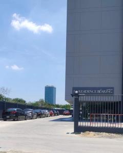 a parking lot with cars parked in a parking lot at PT Residence Bearing in Bangna