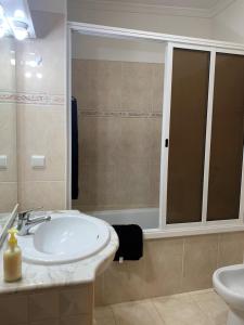 a bathroom with a sink and a toilet at Bento Lodge by Madeira Holiday Rentals in Ribeira Brava