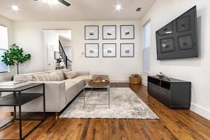 a living room with a couch and a table at Beautiful Contemporary 4BR near Downtown Dallas in Dallas