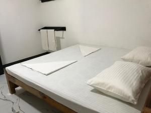 Postel nebo postele na pokoji v ubytování aji fruit farm