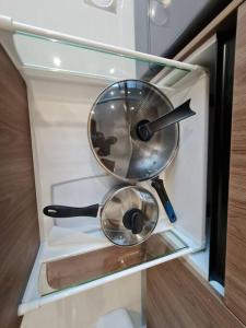 a drawer with a strainer and other utensils in it at Lovely Kozi Square Studio Bedroom with Pool LV5C in Kuching