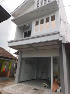 a house being constructed with the front door open at Anyak's place Syariah in Yogyakarta