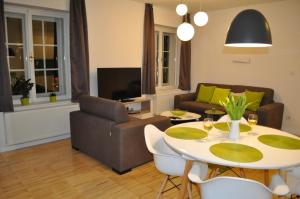Televízia a/alebo spoločenská miestnosť v ubytovaní Apartments City&style